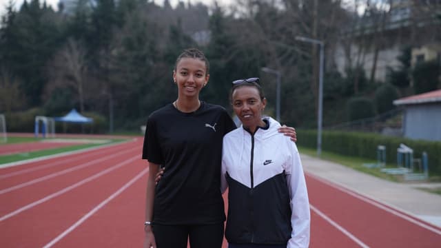 Coaches training athletes