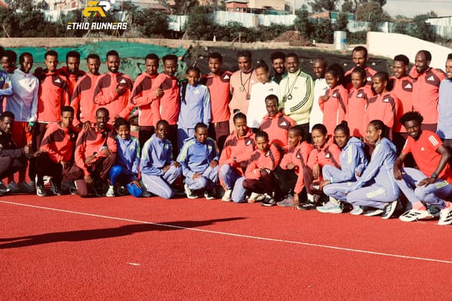 Coaches training athletes